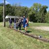 Crew working on replacing railroad ties